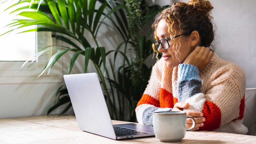 woman reading her doctoral dissertation online