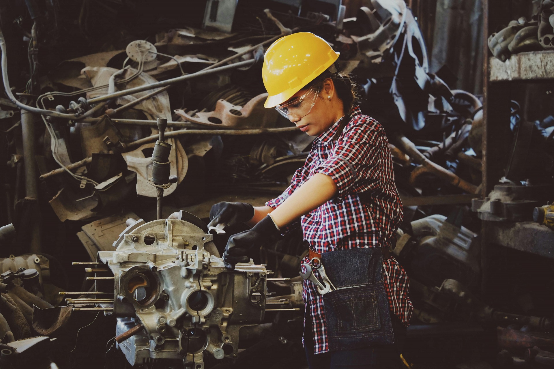 trades school machine worker building an engine