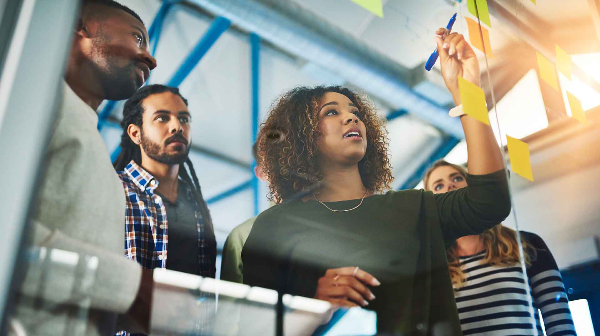 marketing team having a scrum meeting to brainstorm ideas